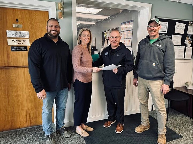 Middle Township Mayor Chris Leusner hands in his nominating petitions to municipal Clerk-Administrator Kimberly Osmundsen while joined by Committeeman Jim Norris, left, and Deputy Mayor Ike Gandy. (Photo courtesy of Prime Digital Marketing)