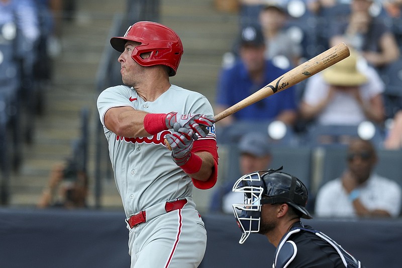 Mar 14, 2026; Tampa, Florida, USA; Philadelphia Phillies right fielder Dylan Moore (25) hits an rbi single against the New York Yankees in the third inning during spring training at George M. Steinbrenner Field. Mandatory Credit: Nathan Ray Seebeck-Imagn Images