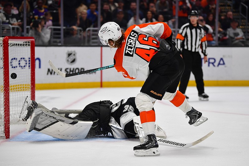 Mar 19, 2026; Los Angeles, California, USA; Philadelphia Flyers center Trevor Zegras (46) scores a goal against Los Angeles Kings goaltender Darcy Kuemper (35) during the shootout period at Crypto.com Arena. Mandatory Credit: Gary A. Vasquez-Imagn Images