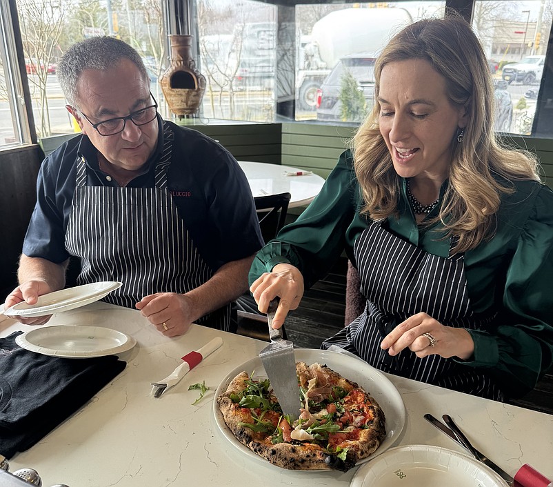 Carlo Citera, owner of Carluccio's Coal Fired Pizza in Northfield, hosts Gov. Mikie Sherrill for a meal.