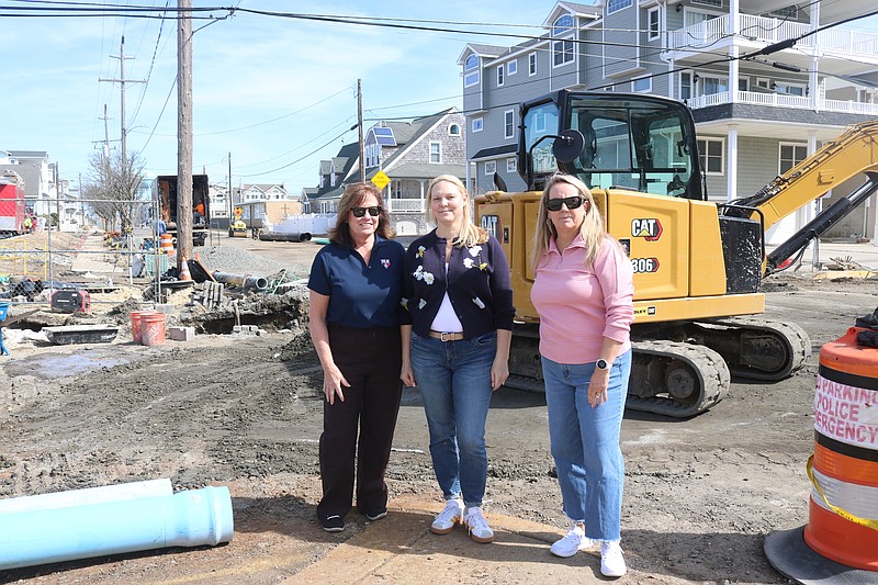 From left, Sea Isle City residents Terry Propper, Beth Pearce and Lori Branco stand in the middle of drainage construction at the corner of 46h Street and Central Avenue near their homes. The photo was taken March 10, when construction was more intense.