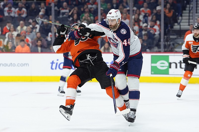 Mar 24, 2026; Philadelphia, Pennsylvania, USA; Columbus Blue Jackets defenseman Erik Gudbranson (44) hits Philadelphia Flyers right wing Garnet Hathaway (19) in the first period at Xfinity Mobile Arena. Mandatory Credit: Kyle Ross-Imagn Images