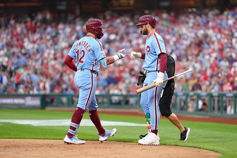 Aug 28, 2025; Philadelphia, Pennsylvania, USA; Philadelphia Phillies designated hitter Kyle Schwarber (12) reacts with infielder Bryce Harper (3) after hitting a home run against the Atlanta Braves in the first inning at Citizens Bank Park. Mandatory Credit: Kyle Ross-Imagn Images