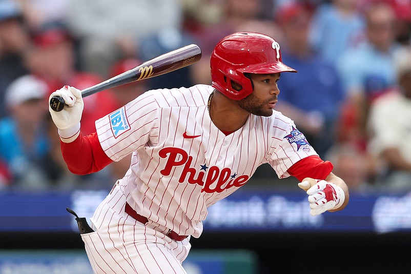 Mar 26, 2026; Philadelphia, Pennsylvania, USA; Philadelphia Phillies center fielder Justin Crawford (2) hits a single during the fifth inning against the Texas Rangers at Citizens Bank Park. Mandatory Credit: Bill Streicher-Imagn Images