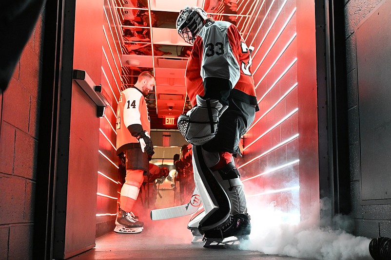 Mar 26, 2026; Philadelphia, Pennsylvania, USA; Philadelphia Flyers center Sean Couturier (14) and  goaltender Samuel Ersson (33) in the tunnel before game against the Chicago Blackhawks at Xfinity Mobile Arena. Mandatory Credit: Eric Hartline-Imagn Images