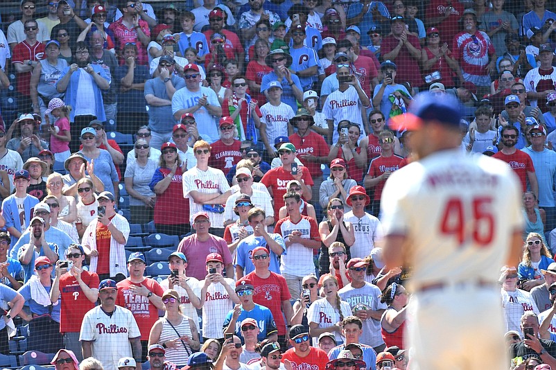 Jul 6, 2025; Philadelphia, Pennsylvania, USA; Fans stand for the final out during the ninth inning as Philadelphia Phillies pitcher Zack Wheeler (45) pitches a complete game one-hit win against the Cincinnati Reds at Citizens Bank Park. Mandatory Credit: Eric Hartline-Imagn Images