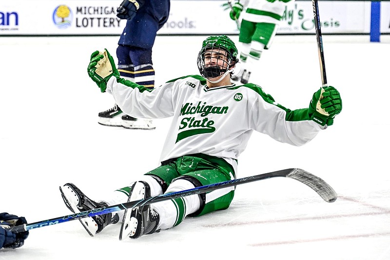 Michigan State's Porter Martone celebrates his empty net goal against Notre Dame during the third period on Thursday, Feb. 19, 2026, at the Munn Ice Arena in East Lansing.