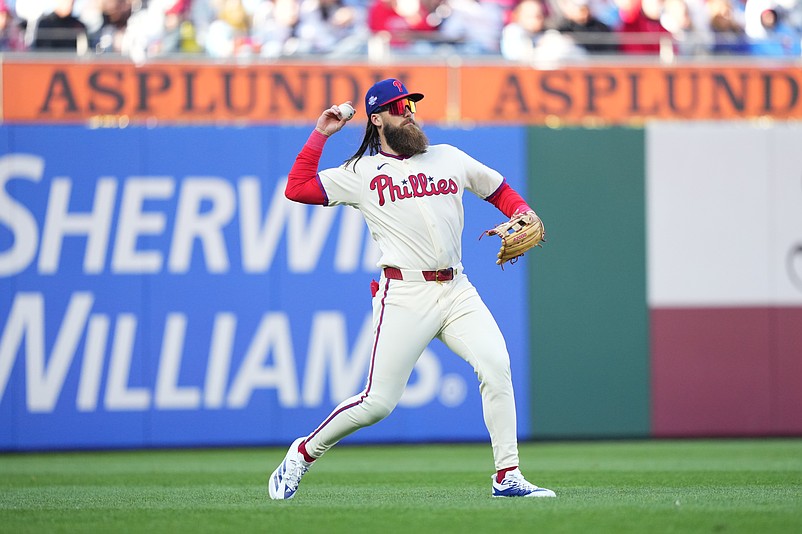 Mar 28, 2026; Philadelphia, Pennsylvania, USA; Philadelphia Phillies outfielder Brandon Marsh (16) fields the ball against the Texas Rangers in the fifth inning at Citizens Bank Park. Mandatory Credit: Kyle Ross-Imagn Images