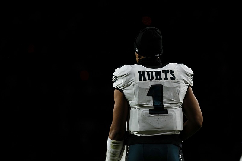 Dec 20, 2025; Landover, Maryland, USA; Philadelphia Eagles quarterback Jalen Hurts (1) looks on from the sidelines during a stoppage in play against the Washington Commanders in the second half at Northwest Stadium. Mandatory Credit: Amber Searls-Imagn Images