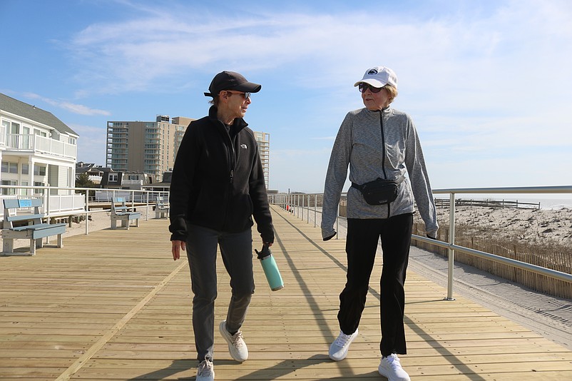 Ocean City residents Susan Gailey, left, and Carol Bittner enjoy the new Boardwalk while taking a stroll.