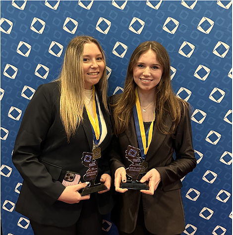 Leah Drewnowski, left, and Dani Ritzel celebrate their wins at the New Jersey State Career Development Conference. (Courtesy of Ocean City School District)