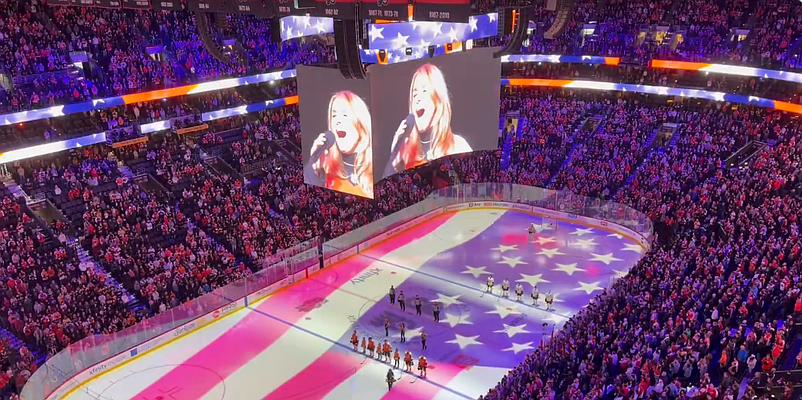 Lauren Hart sings 'God Bless America' prior to the Philadelphia Flyers game against the Boston Bruins on April 5, 2026 (Credit @JoyonBroad on X)