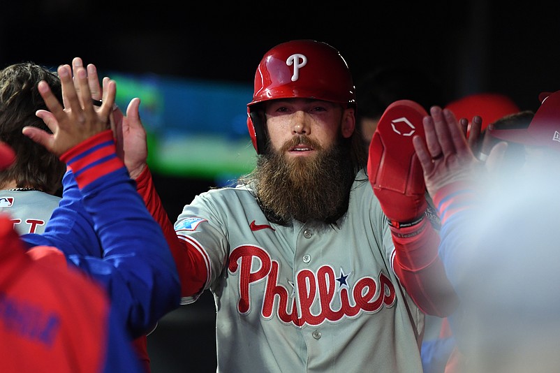 Apr 4, 2026; Denver, Colorado, USA; Philadelphia Phillies infielder Alec Bohm (28) is congratulated by teammates after scoring during the fifth inning against the Colorado Rockies at Coors Field. Mandatory Credit: Christopher Hanewinckel-Imagn Images