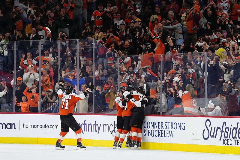 Apr 5, 2026; Philadelphia, Pennsylvania, USA; Philadelphia Flyers right wing Porter Martone (94) celebrates with teammates after scoring a goal against the Boston Bruins in overtime at Xfinity Mobile Arena. Mandatory Credit: Kyle Ross-Imagn Images