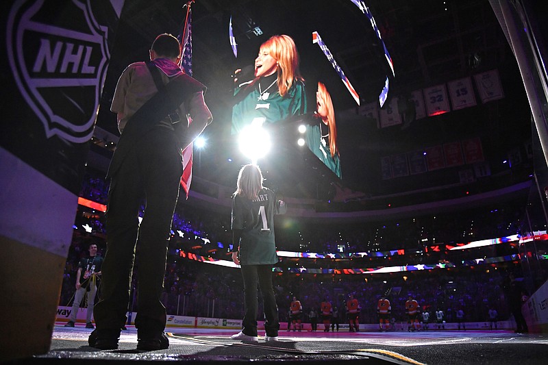 Feb 12, 2023; Philadelphia, Pennsylvania, USA; Philadelphia Flyers vocalist Lauren Hart sings the national anthem before game against the Seattle Kraken at Wells Fargo Center. Mandatory Credit: Eric Hartline-USA TODAY Sports