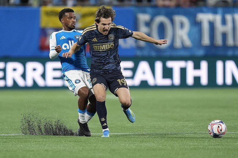 Union midfielder Indiana Vassilev, right, is pursued by Charlotte FC defender Nathan Byrne during the first half of the April 4 game at Bank of America Stadium. (Jim Dedmon-Imagn Images)