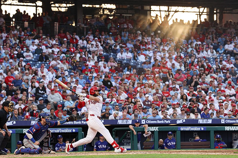 Mar 26, 2026; Philadelphia, Pennsylvania, USA; Philadelphia Phillies center fielder Brandon Marsh (16) hits a double during the eighth inning against the Texas Rangers at Citizens Bank Park. Mandatory Credit: Bill Streicher-Imagn Images