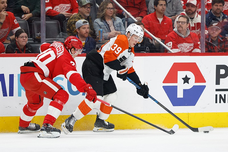 Mar 28, 2026; Detroit, Michigan, USA;  Philadelphia Flyers right wing Matvei Michkov (39) skates with the puck defended by Detroit Red Wings defenseman Albert Johansson (20) in the first period at Little Caesars Arena. Mandatory Credit: Rick Osentoski-Imagn Images