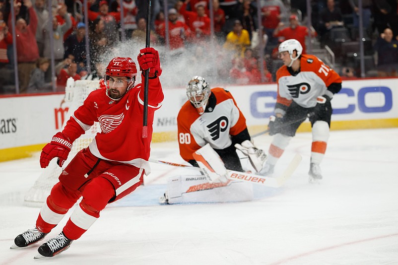 Mar 28, 2026; Detroit, Michigan, USA;  Detroit Red Wings center Dylan Larkin (71) celebrates after scoring on Philadelphia Flyers goaltender Dan Vladar (80) in the second period at Little Caesars Arena. Mandatory Credit: Rick Osentoski-Imagn Images