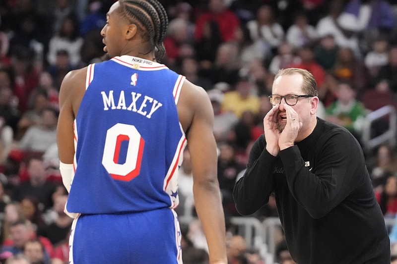 Dec 26, 2025; Chicago, Illinois, USA; Philadelphia 76ers head coach Nick Nurse talks with guard Tyrese Maxey (0) against the Chicago Bulls during the second half at United Center. Mandatory Credit: David Banks-Imagn Images
