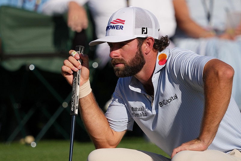 Apr 11, 2026; Augusta, Georgia, USA; Cameron Young lines up a putt on the 18th green during the third round of the Masters Tournament at Augusta National Golf Club. Mandatory Credit: Michael Madrid-Imagn Images