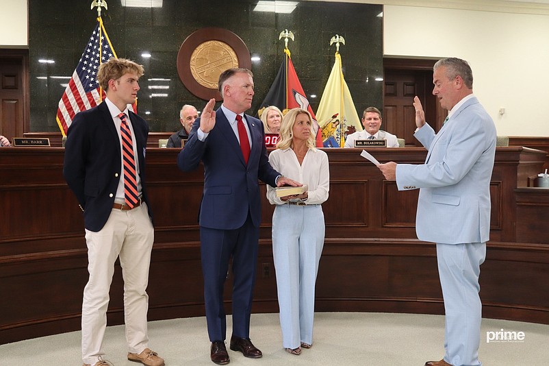 Joined by his family, Cape May County Commissioner Patrick Rosenello takes the oath of office from former New Jersey Superior Court Judge Michael Donohue. (Photo courtesy of Prime Digital Marketing)