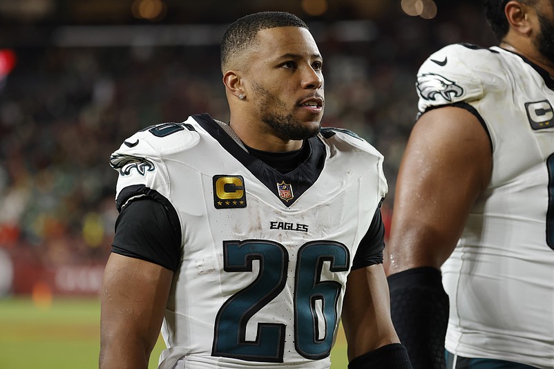 Dec 20, 2025; Landover, Maryland, USA; Philadelphia Eagles running back Saquon Barkley (26) walks off the field after the first half against the Washington Commanders at Northwest Stadium. Mandatory Credit: Amber Searls-Imagn Images