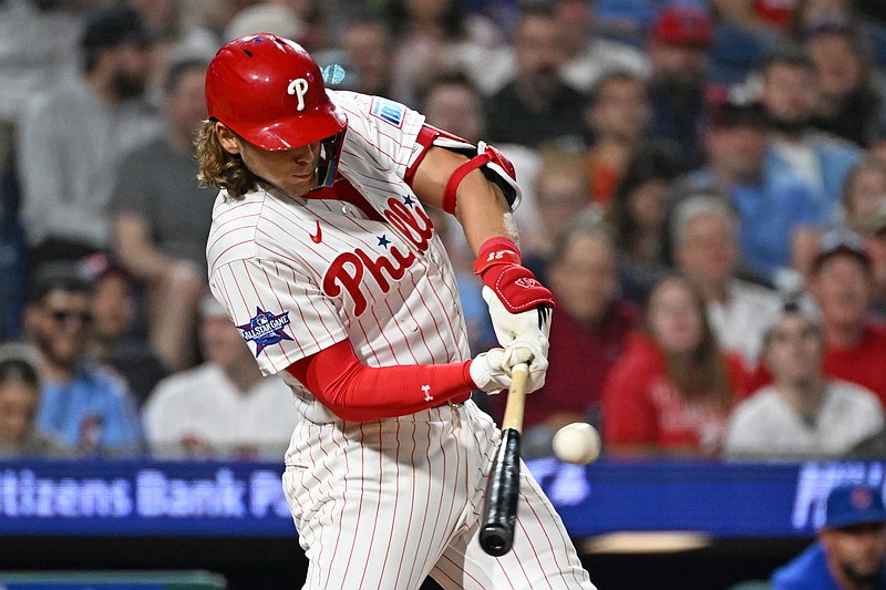 Apr 13, 2026; Philadelphia, Pennsylvania, USA; \Philadelphia Phillies third baseman Alec Bohm (28) hits an RBI single against the Chicago Cubs during the fifth inning at Citizens Bank Park. Mandatory Credit: Eric Hartline-Imagn Images