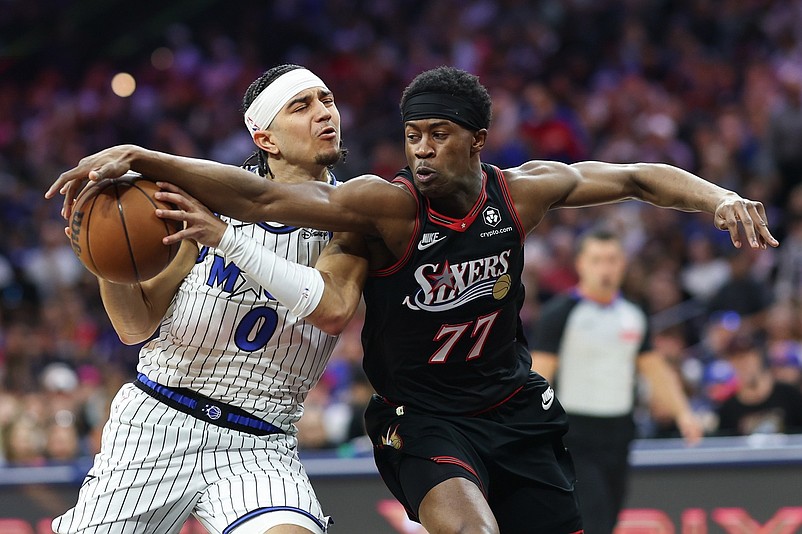 Apr 15, 2026; Philadelphia, Pennsylvania, USA; Orlando Magic guard Anthony Black (0) drives against Philadelphia 76ers guard Vj Edgecombe (77) during the second quarter of a play-in round of the 2026 NBA Playoffs at Xfinity Mobile Arena. Mandatory Credit: Bill Streicher-Imagn Images