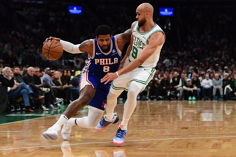 Apr 19, 2026; Boston, Massachusetts, USA; Philadelphia 76ers forward Paul George (8) controls the ball while Boston Celtics guard Derrick White (9) defends in the first half during game one of the first round of the 2026 NBA Playoffs at TD Garden. Mandatory Credit: Bob DeChiara-Imagn Images