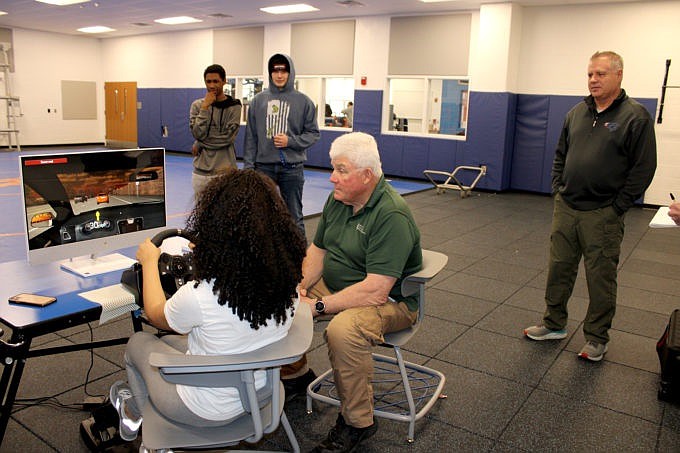 A student tries out the DUI simulator. (Photo courtesy of John R. Elliott HERO Campaign)