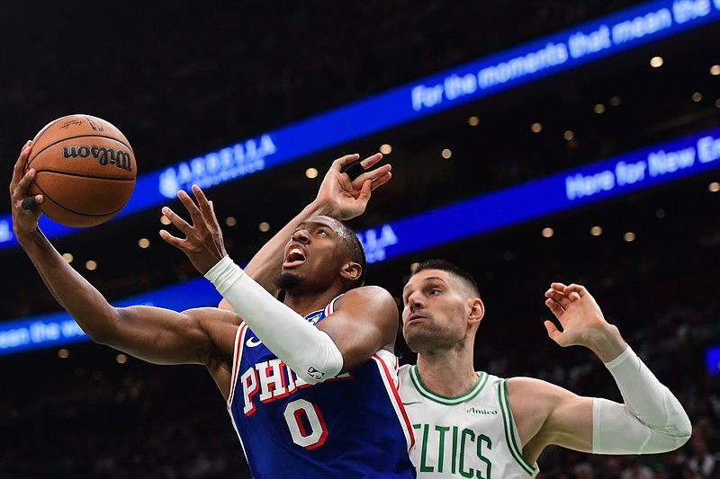 Apr 19, 2026; Boston, Massachusetts, USA; Philadelphia 76ers guard Tyrese Maxey (0) drives to the basket past Boston Celtics center Nikola Vucevic (4) in the first half during game one of the first round of the 2026 NBA Playoffs at TD Garden. Mandatory Credit: Bob DeChiara-Imagn Images
