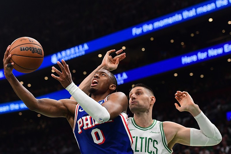 Apr 19, 2026; Boston, Massachusetts, USA; Philadelphia 76ers guard Tyrese Maxey (0) drives to the basket past Boston Celtics center Nikola Vucevic (4) in the first half during game one of the first round of the 2026 NBA Playoffs at TD Garden. Mandatory Credit: Bob DeChiara-Imagn Images