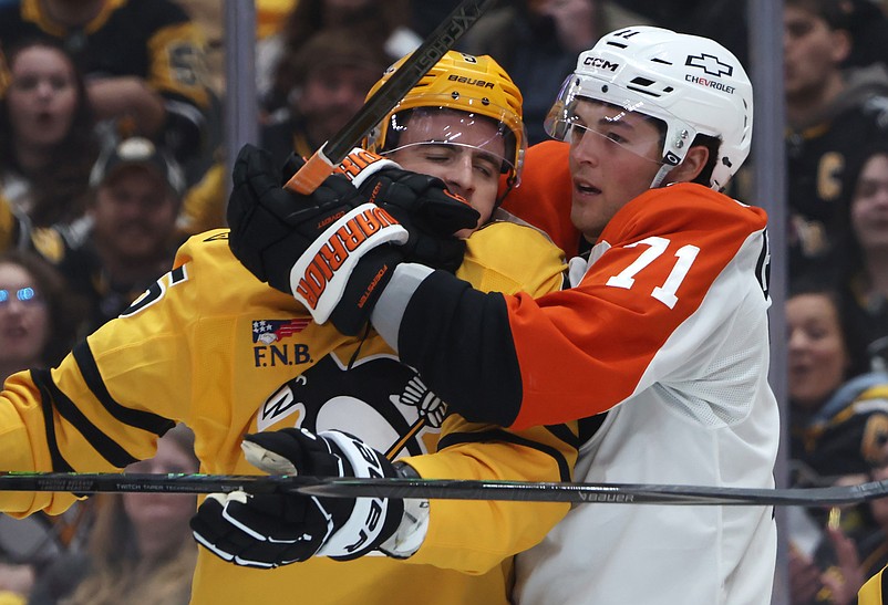Apr 20, 2026; Pittsburgh, Pennsylvania, USA;  Philadelphia Flyers right wing Tyson Foerster (71) wraps up Pittsburgh Penguins defenseman Ryan Shea (5) after a stoppage in play during the second period in game two of the first round of the 2026 Stanley Cup Playoffs at PPG Paints Arena. Mandatory Credit: Charles LeClaire-Imagn Images