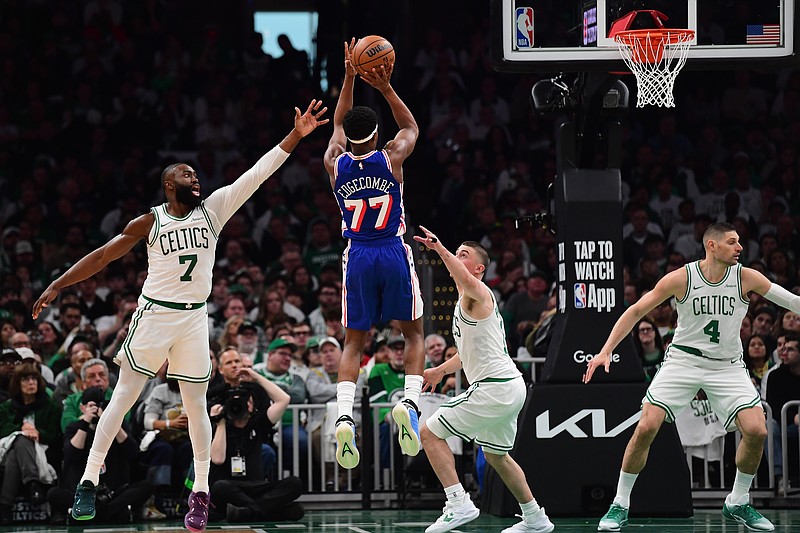 Apr 19, 2026; Boston, Massachusetts, USA; Philadelphia 76ers guard Vj Edgecombe (77) shoots the ball between Boston Celtics guard Jaylen Brown (7) and guard Payton Pritchard (11) in the second half during game one of the first round of the 2026 NBA Playoffs at TD Garden. Mandatory Credit: Bob DeChiara-Imagn Images