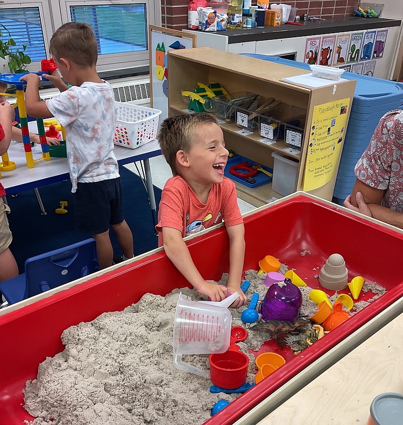 An Ocean City Primary School preschool student enjoys a sandbox activity. (Photo courtesy of Ocean City school district)