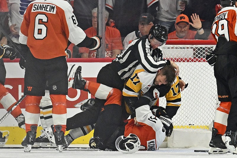 Apr 22, 2026; Philadelphia, Pennsylvania, USA; Pittsburgh Penguins right wing Bryan Rust (17) wrestles with Philadelphia Flyers right wing Travis Konecny (11) during the second period in game three of the first round of the 2026 Stanley Cup Playoffs at Xfinity Mobile Arena. Mandatory Credit: Eric Hartline-Imagn Images