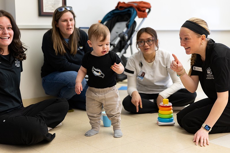 STOCKTON/From left, Madison Kapuscinski, a MS in Communication Disorders student from Marlton; mother Sarah Citro with her son Luca; Alyanna Frias, a Nursing student from Toms River; and Kelsey Bigum, a MS in Occupational Therapy student from Manahawkin. Sarah brought her son to participate in Baby Day on April 6.