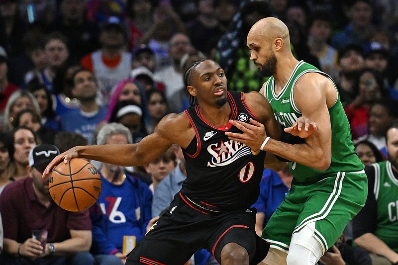 Apr 24, 2026; Philadelphia, Pennsylvania, USA; Philadelphia 76ers guard Tyrese Maxey (0) is defended by Boston Celtics guard Derrick White (9) during the first half at Xfinity Mobile Arena. Mandatory Credit: Eric Hartline-Imagn Images