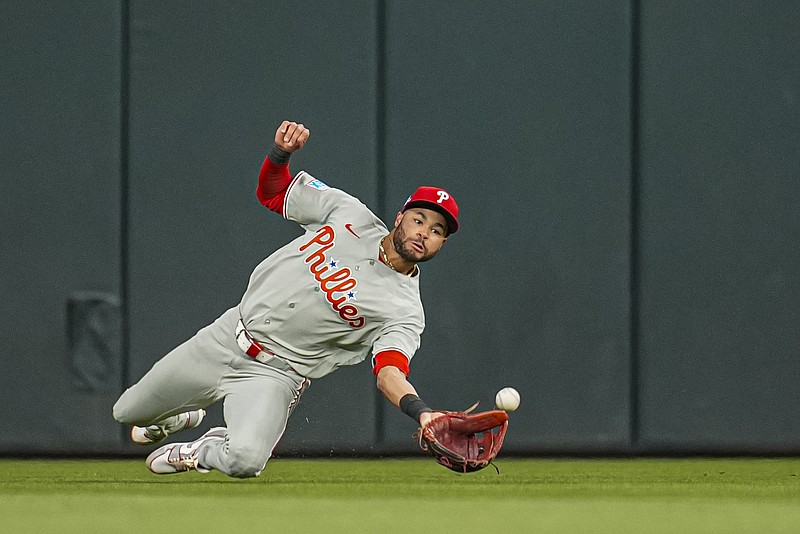 Apr 24, 2026; Cumberland, Georgia, USA; Philadelphia Phillies center fielder Justin Crawford (2) makes a diving catch on a ball hit by Atlanta Braves third baseman Austin Riley (27) (not shown) during the sixth inning at Truist Park. Mandatory Credit: Dale Zanine-Imagn Images