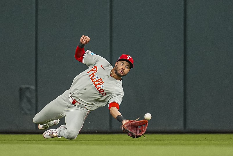 Apr 24, 2026; Cumberland, Georgia, USA; Philadelphia Phillies center fielder Justin Crawford (2) makes a diving catch on a ball hit by Atlanta Braves third baseman Austin Riley (27) (not shown) during the sixth inning at Truist Park. Mandatory Credit: Dale Zanine-Imagn Images