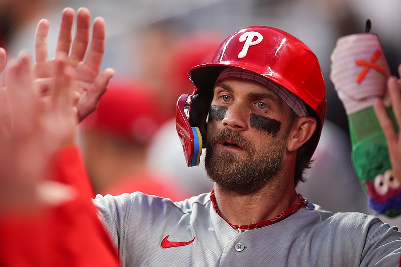 Apr 25, 2026; Atlanta, Georgia, USA; Philadelphia Phillies first baseman Bryce Harper (3) celebrates with teammates after scoring a run against the Atlanta Braves in the first inning at Truist Park. Mandatory Credit: Brett Davis-Imagn Images