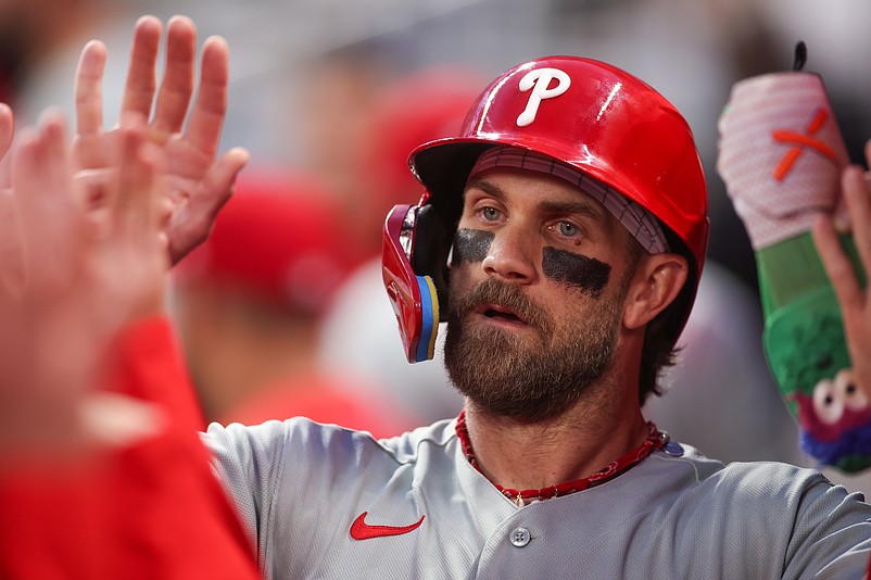 Apr 25, 2026; Atlanta, Georgia, USA; Philadelphia Phillies first baseman Bryce Harper (3) celebrates with teammates after scoring a run against the Atlanta Braves in the first inning at Truist Park. Mandatory Credit: Brett Davis-Imagn Images
