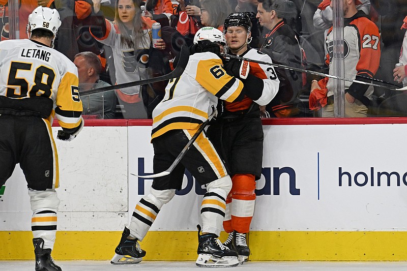 Apr 25, 2026; Philadelphia, Pennsylvania, USA; Pittsburgh Penguins right wing Rickard Rakell (67) and Philadelphia Flyers right wing Matvei Michkov (39) battle after the game in game four of the first round of the 2026 Stanley Cup Playoffs at Xfinity Mobile Arena. Mandatory Credit: Eric Hartline-Imagn Images