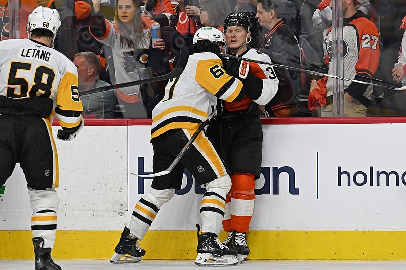 Apr 25, 2026; Philadelphia, Pennsylvania, USA; Pittsburgh Penguins right wing Rickard Rakell (67) and Philadelphia Flyers right wing Matvei Michkov (39) battle after the game in game four of the first round of the 2026 Stanley Cup Playoffs at Xfinity Mobile Arena. Mandatory Credit: Eric Hartline-Imagn Images