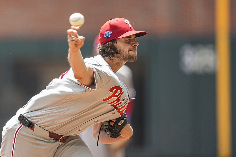 Apr 26, 2026; Cumberland, Georgia, USA; Philadelphia Phillies pitcher Aaron Nola (27) pitches against the Atlanta Braves during the first inning at Truist Park. Mandatory Credit: Dale Zanine-Imagn Images