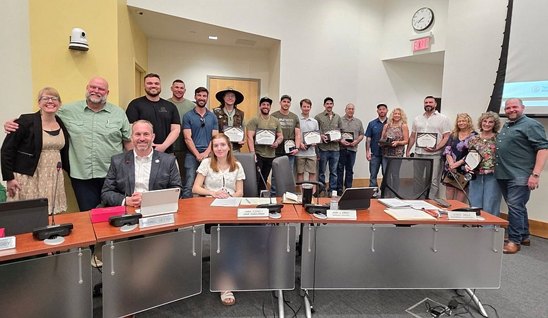 Lansdale Electric Department employees were honored by borough council to mark National Line Worker Appreciation Week at the April 15, 2026 borough council meeting. From left to right are: seated, councilman Mike Yetter and junior councilperson Anna Szekely; standing are Mayor Rachael Bollens, electric Superintendent Andy Krauss, electric linemen Harry Chapin, Josh Greaf, Matt Bladek, and Raiden Neuman; Line Foremen Ben Curran and Matt Hamilton, linemen Sam Baruffi and Jeff Horvath, Lead Electrician Steve Pulli, Safety and Substations TJ Giampa, Office manager Donna Markley, Revenue Metering and Communications head Joe Green, Utility billing coordinator Grace Trail, Utilities administrator Maria Lohan, and Councilman Andrew Carroll. (Photo courtesy of Lansdale Electric)