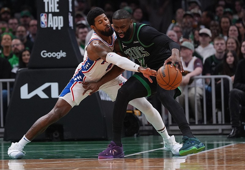 Apr 28, 2026; Boston, Massachusetts, USA; Philadelphia 76ers forward Paul George (8) defends against Boston Celtics guard Jaylen Brown (7) in the second quarter during game five of the first round of the 2026 NBA Playoffs at TD Garden. Mandatory Credit: David Butler II-Imagn Images