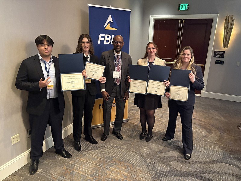 From left: Jeremy Grady, Patrick Hennessy, Damon Gray, Sloane Harker and Brittany Hamilton. Montgomery County Community College Future Business Leaders of America Club took some of the top prizes at FBLA’s 54th annual Collegiate Chapter Conference in Harrisburg March 27 and 28. Photo by Damon Gray