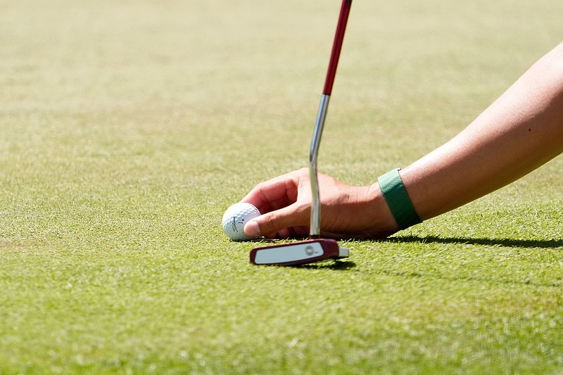 Apr 12, 2026; Augusta, Georgia, USA; A detail view of Haotong Li placing his golf ball on the sixth tee during the final round of the Masters Tournament at Augusta National Golf Club. Mandatory Credit: Katie Goodale-Imagn Images